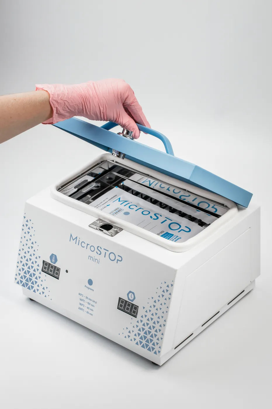 MicroSTOP MINI steriliser opened with pouch loaded inside