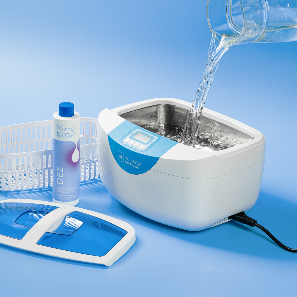 PROMAX Ultrasonic Cleaner filled with water and MicroSTOP disinfectant